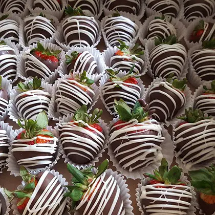 Chocolate covered strawberries with white drizzle