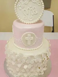 Pink and white tiers with cross and flowers