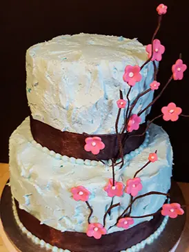 A textured cake with cherry blossom branches